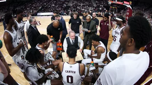Team huddle during timeout versus Missouri