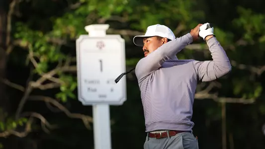 Phichaksn Maichon holds his backswing and admires a titanic blast on No. 1 at Traditions Club