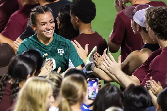 Sydney Fuller is greeted by a boot line at halftime of the Aggies' 3-0 win over Fairfield.
