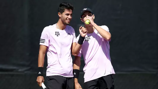 COLLEGE STATION, TX - February 25, 2024 - Togan Tokac of the Texas A&M Aggies and Giulio Perego of the Texas A&M Aggies during the game between the Pepperdine Waves and the Texas A&M Aggies at Mitchell Tennis Center in College Station, TX. Photo By Aiden Shertzer/Texas A&M Athletics