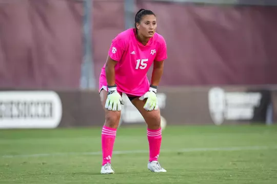 Maysen Veronda dons the electric pink goalkeeper kit as she is ready to pounce in the Aggies' exhibition match against Rice