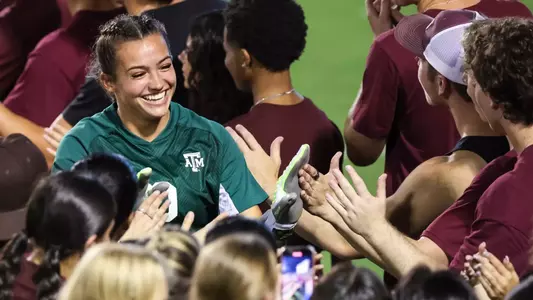 Sydney Fuller is greeted by a boot line at halftime of the Aggies' 3-0 win over Fairfield.