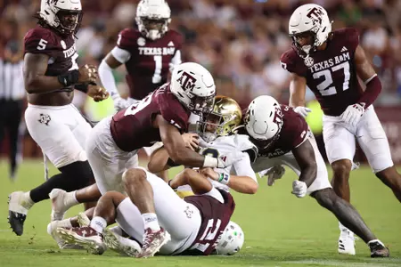 COLLEGE STATION, TX - August 31, 2024 - Defensive lineman Cashius Howell #18 of the Texas A&M Aggies, Linebacker Taurean York #21 of the Texas A&M Aggies, and Defensive lineman Shemar Stewart #4 of the Texas A&M Aggies during the game between the Notre Dame Fighting Irish and the Texas A&M Aggies at Kyle Field in College Station, TX. Photo By Rachel Mahan/Texas A&M Athletics