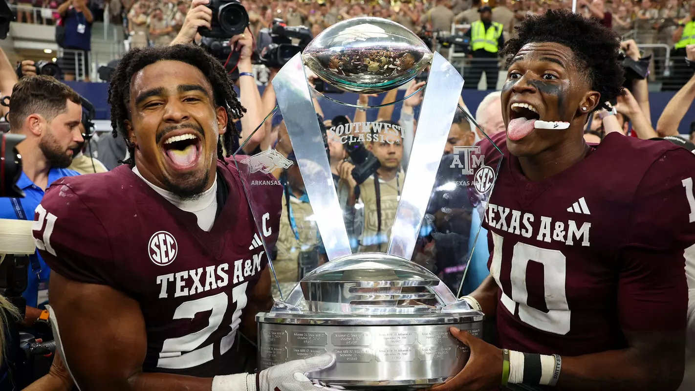 Taurean York and Marcel Reed with the Southwest Classic Trophy
