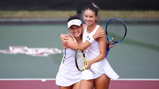 COLLEGE STATION, TX - March 03, 2024 - Lucciana Perez of the Texas A&M Aggies and Jeanette Mireles of the Texas A&M Aggies during the game between the Florida Gators and the Texas A&M Aggies at Mitchell Tennis Center in College Station, TX. Photo By Sydney Morriss/Texas A&M Athletics