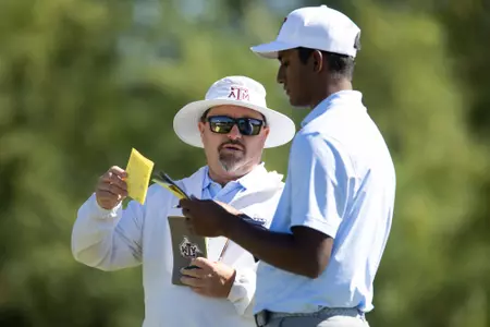 SCOTTSDALE, AZ - May 25, 2023 - Head Coach Brian Kortan of the Texas A&M Aggies and Vishnu Sadagopan of the Texas A&M Aggies during practice NCAA Men?s Golf Championships at Grayhawk Golf Course in Scottsdale, AZ. Photo By Ethan Mito/Texas A&M Athletics