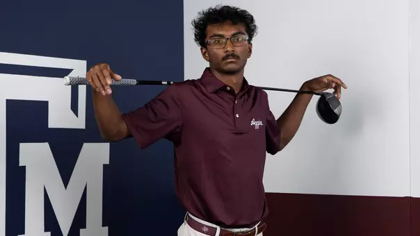 Shiv Parmar strikes a Bo Jackson pose, but with a driver instead of a baseball bat.