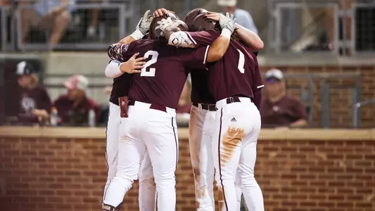 Nico Partida & team celebrate after HR