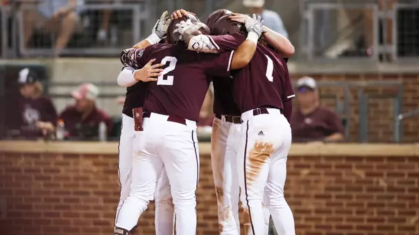 Nico Partida & team celebrate after HR