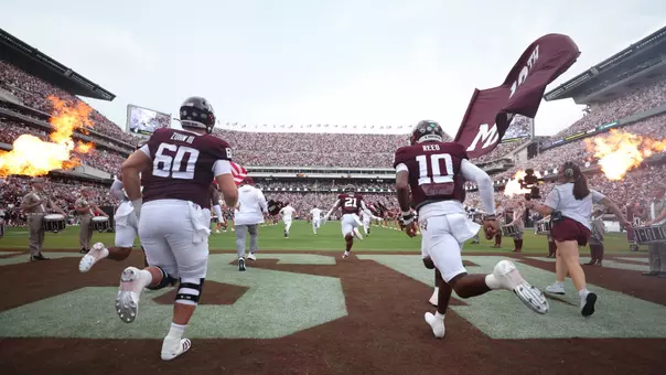COLLEGE STATION, TX - August 30, 2025 - Offensive lineman Trey Zuhn III #60 of the Texas A&M Aggies and Quarterback Marcel Reed #10 of the Texas A&M Aggies during the game between the UT San Antonio Roadrunners and the Texas A&M Aggies at Kyle Field in College Station, TX. Photo By Evan Pilat/Texas A&M Athletics