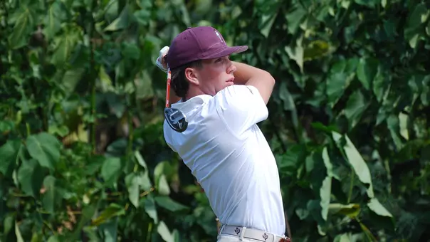 Wheaton Ennis admires a drive at the John A. Burns Intercollegiate
