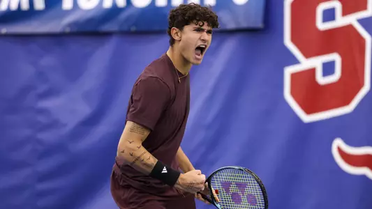 DALLAS, TX - February 14, 2025 - Tiago Pires of the Texas A&M Aggies during the game against the Texas Longhorns at ITA Indoor Nationals at Styslinger /Altec Tennis Complex in  Dallas, Texas. Photo By Julianne Shivers/Texas A&M Athletics