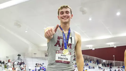 Blake Harris on the podium with his gold medal after winning the heptathlon