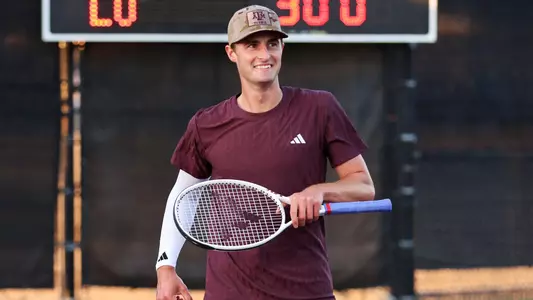 COLLEGE STATION, TX - February 23, 2025 - Matthis Ross of the Texas A&M Aggies during the game between the Lamar Cardinals and the Texas A&M Aggies at Mitchell Tennis Center in College Station, TX. Photo By Bailee Wagner/Texas A&M Athletics