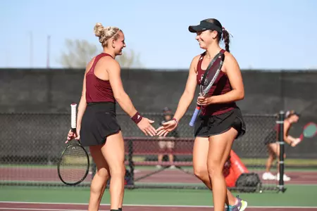 COLLEGE STATION, TX - March 21, 2025 - Daria Smetannikov of the Texas A&M Aggies and Mia Kupres of the Texas A&M Aggies during the game between the Ole Miss Rebels and the Texas A&M Aggies at Mitchell Tennis Center in College Station, TX. Photo By Sydney Stevenson/Texas A&M Athletics