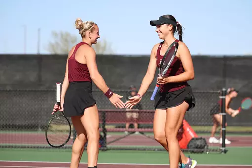 COLLEGE STATION, TX - March 21, 2025 - Daria Smetannikov of the Texas A&M Aggies and Mia Kupres of the Texas A&M Aggies during the game between the Ole Miss Rebels and the Texas A&M Aggies at Mitchell Tennis Center in College Station, TX. Photo By Sydney Stevenson/Texas A&M Athletics