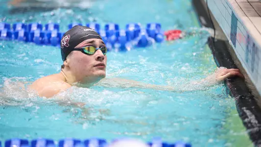 Ben Scholl checking his time at SEC Championships