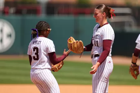 COLLEGE STATION, TX - April 13, 2025 - Koko Wooley #3 of the Texas A&M Aggies and Emiley Kennedy #11 of the Texas A&M Aggies during the game between the LSU Tigers and the Texas A&M Aggies at Davis Diamond in College Station, TX. Photo By Evan Pilat/Texas A&M Athletics