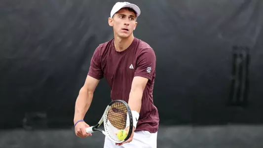 COLLEGE STATION, TX - April 05, 2025 - Theo Papamalamis of the Texas A&M Aggies during the game between the Texas Longhorns and the Texas A&M Aggies at Mitchell Tennis Center in College Station, TX. Photo By Julianne Shivers/Texas A&M Athletics