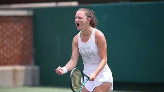 Nicole Khirin celebrates winning a point at NCAA Semifinal