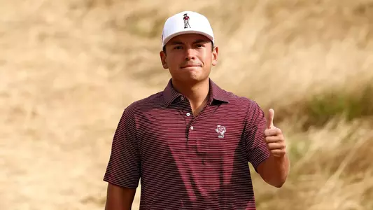 Jacob Sosa flashes a Gig 'em at the NCAA Tournament