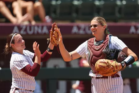 COLLEGE STATION, TX - April 13, 2025 - Emily Leavitt #25 of the Texas A&M Aggies, DeeDee Baldwin #39 of the Texas A&M Aggiesduring the game between the LSU Tigers and the Texas A&M Aggies at Davis Diamond in College Station, TX. Photo By Hannah Harrison/Texas A&M Athletics