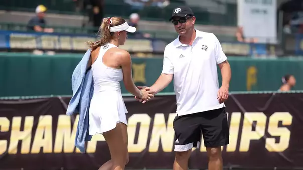 WACO, TX - May 17, 2025 - Lexington Reed of the Texas A&M Aggies and Head Coach Mark Weaver of the Texas A&M Aggies during the NCAA Final Four game between the Texas A&M Aggies and the Michigan Wolverines at Hurd Tennis Center in Waco, TX. Photo By Chris Swann/Texas A&M Athletics
