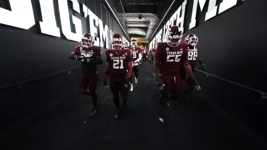 COLLEGE STATION, TX - November 16, 2024 - Defensive back Dalton Brooks #25 of the Texas A&M Aggies and Linebacker Taurean York #21 of the Texas A&M Aggies and Offensive lineman Ar'maj Reed-Adams #55 of the Texas A&M Aggies during the game between the New Mexico State Aggies and the Texas A&M Aggies at Kyle Field in College Station, TX. Photo By Evan Pilat/Texas A&M Athletics