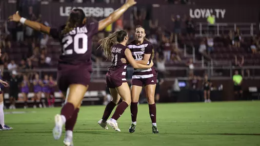 Trinity Buchanan rejoices with Holly Storer and a leading Leah Diaz after scoring an equalizer against Texas State