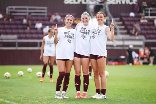 Isabella Yakel, Riley Crooks and Hattie Patterson share a prematch moment.