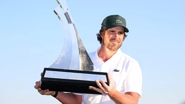 Nacho Elvira holds the Dubai Invitational trophy