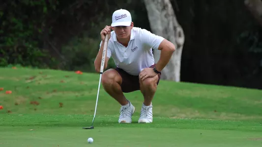 Aaron Pounds eyeballs a putt in the first round of the John A. Burns Intercollegiate