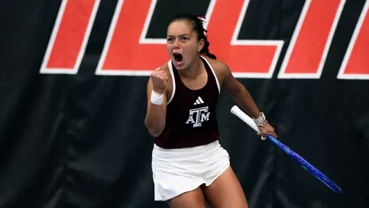 Lucciana Perez celebrates a singles win against Oklahoma
