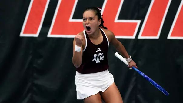 Lucciana Perez celebrates a singles win against Oklahoma