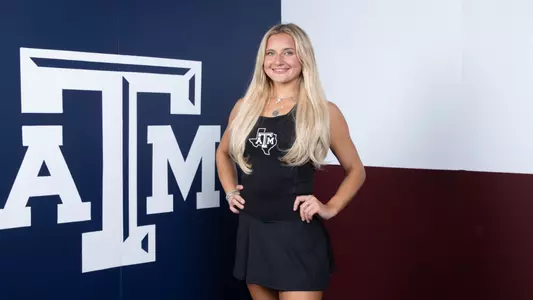 Daria Smetannikov in front of Texas flag