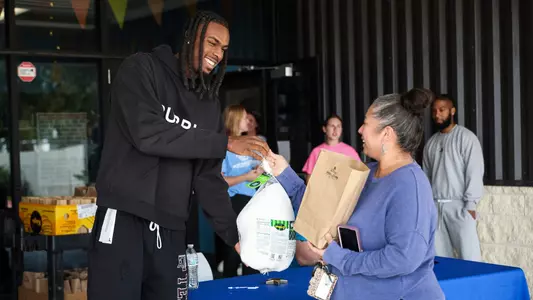BRYAN, TX - November 23, 2025 - Mackenzie Mgbako turkey giveaway in College Station, TX. Photo By Ethan Mito/Texas A&M Athletics