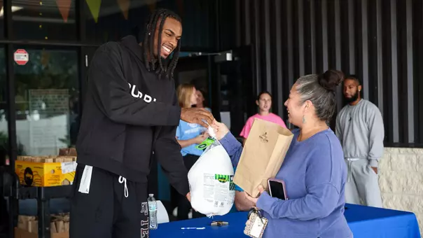 BRYAN, TX - November 23, 2025 - Mackenzie Mgbako turkey giveaway in College Station, TX. Photo By Ethan Mito/Texas A&M Athletics