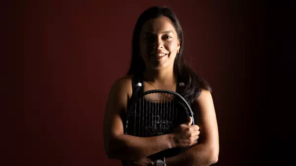 Lucciana Perez is all smiles as she embraces her racquet during a social content day photo shoot