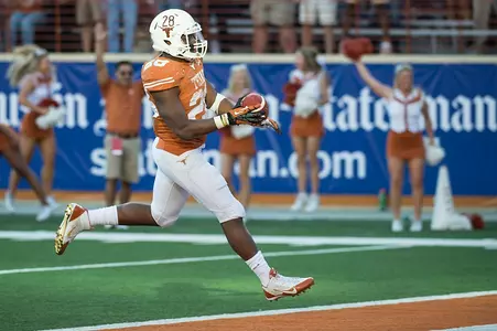 RB Malcolm Brown crosses the goal line for a 30-yard TD.
