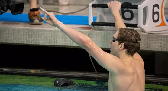 Jake Ritter gives Hook 'Em sign