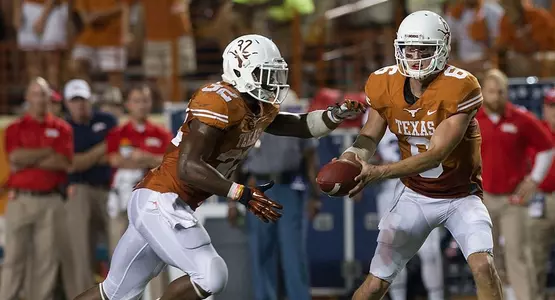 QB Case McCoy hands off to RB Johnathan Gray.