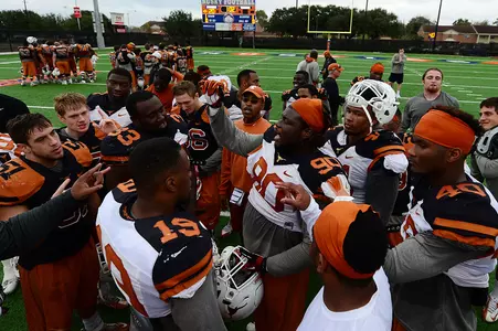 The defense gathers at the end of practice
