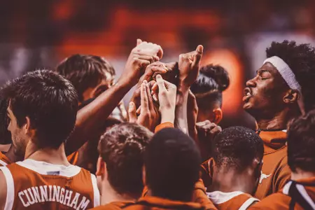 mbb team huddle at Ok State