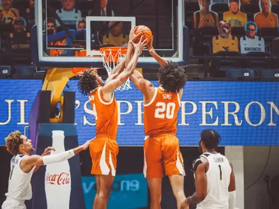 Greg Brown and Jericho Sims rebounding