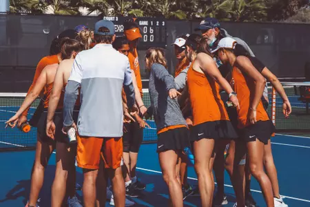women's tennis team huddle