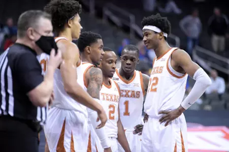 team huddle vs Texas Tech - Big 12 quarters