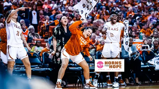 Kobe King-Hawea, Joanne Allen-Taylor, Audrey Warren, and Calamity McCentire celebrating from the team bench. Horns for Hope shoot for a cure logo is over the image.