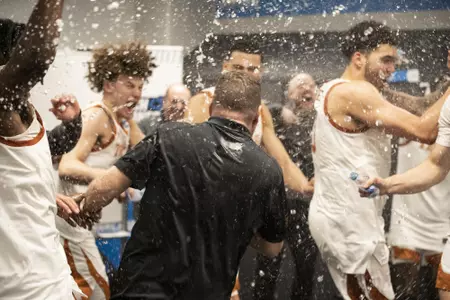 locker room celebration after NCAA first round win