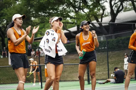 Charlotte-Kylie-Simran cheering during big 12 tourney
