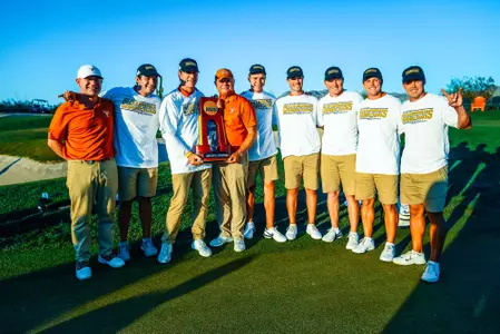 2022 m golf national champions with trophy on 18th green